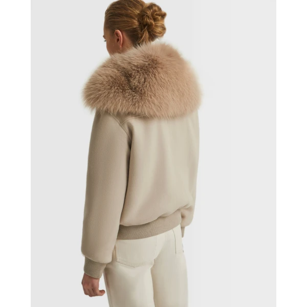 Woman wearing Yves Salomon shearling fur coat – luxury outerwear at Coveti