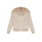Woman wearing Yves Salomon shearling fur coat – luxury outerwear at Coveti