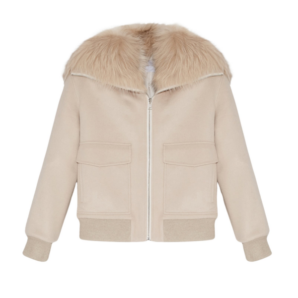 Woman wearing Yves Salomon shearling fur coat – luxury outerwear at Coveti