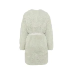 Woman wearing Yves Salomon shearling fur coat – luxury outerwear at Coveti