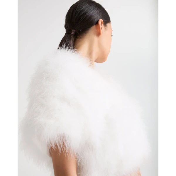 Woman wearing Yves Salomon shearling fur coat – luxury outerwear at Coveti