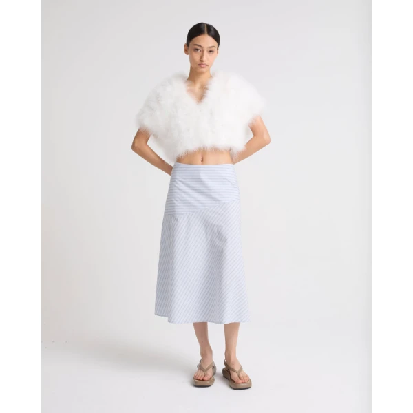 Woman wearing Yves Salomon shearling fur coat – luxury outerwear at Coveti