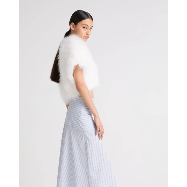 Woman wearing Yves Salomon shearling fur coat – luxury outerwear at Coveti