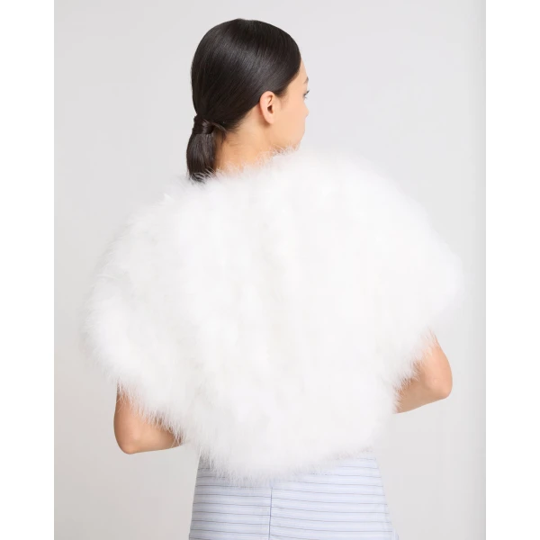 Woman wearing Yves Salomon shearling fur coat – luxury outerwear at Coveti
