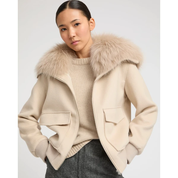 Woman wearing Yves Salomon shearling fur coat – luxury outerwear at Coveti