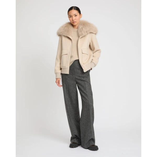 Woman wearing Yves Salomon shearling fur coat – luxury outerwear at Coveti