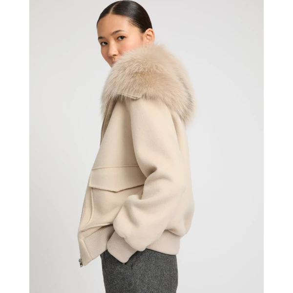 Woman wearing Yves Salomon shearling fur coat – luxury outerwear at Coveti