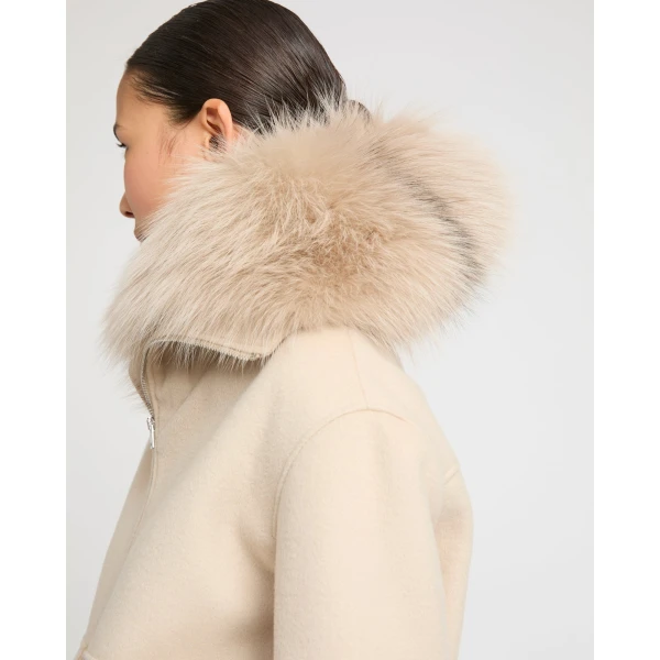 Woman wearing Yves Salomon shearling fur coat – luxury outerwear at Coveti
