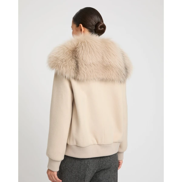 Woman wearing Yves Salomon shearling fur coat – luxury outerwear at Coveti