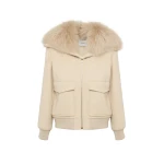 Woman wearing Yves Salomon shearling fur coat – luxury outerwear at Coveti