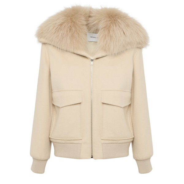 Woman wearing Yves Salomon shearling fur coat – luxury outerwear at Coveti