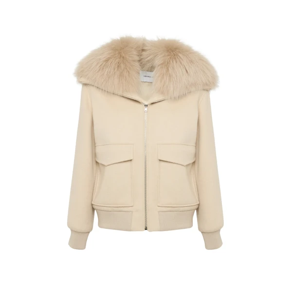 Woman wearing Yves Salomon shearling fur coat – luxury outerwear at Coveti