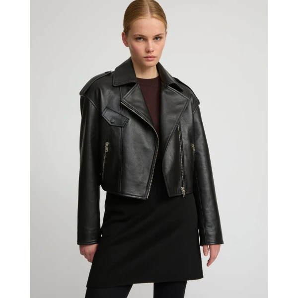 Woman wearing Yves Salomon shearling fur coat – luxury outerwear at Coveti