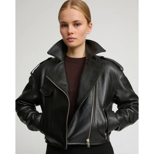 Woman wearing Yves Salomon shearling fur coat – luxury outerwear at Coveti
