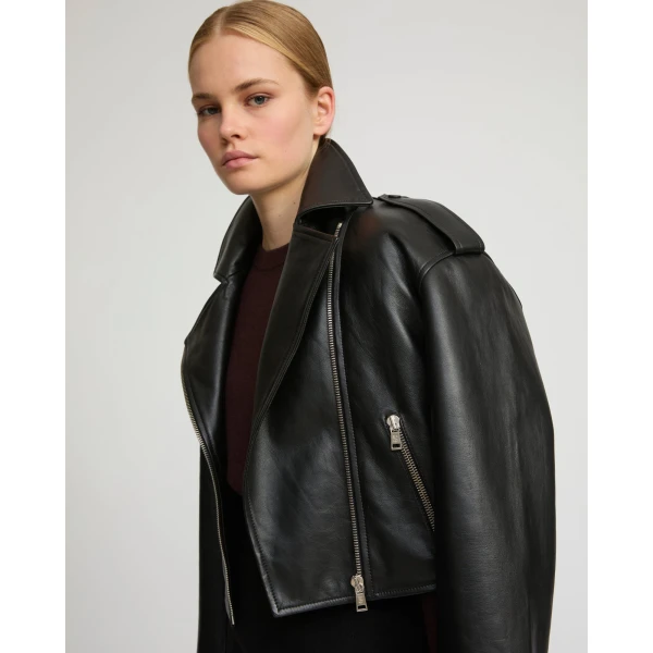 Woman wearing Yves Salomon shearling fur coat – luxury outerwear at Coveti