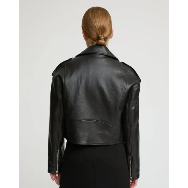 Woman wearing Yves Salomon shearling fur coat – luxury outerwear at Coveti