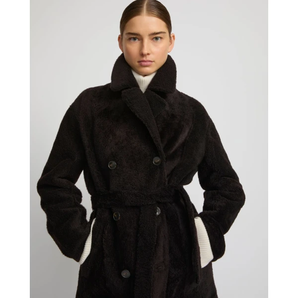 Woman wearing Yves Salomon shearling fur coat – luxury outerwear at Coveti