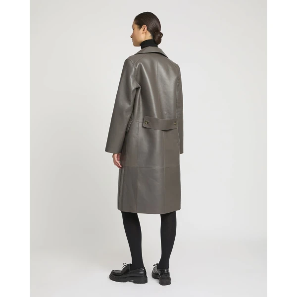Woman wearing Yves Salomon shearling fur coat – luxury outerwear at Coveti