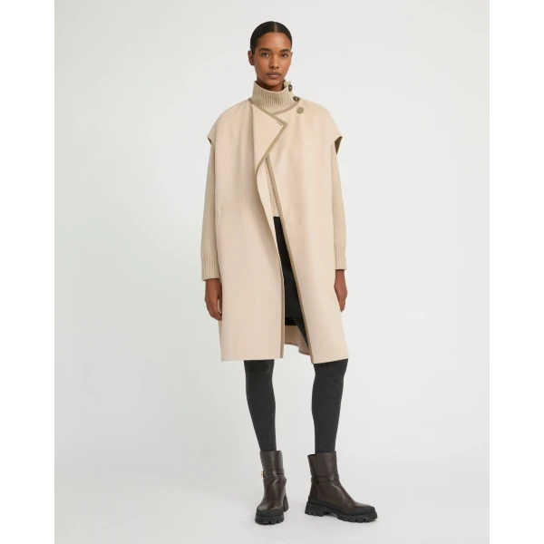 Woman wearing Yves Salomon shearling fur coat – luxury outerwear at Coveti