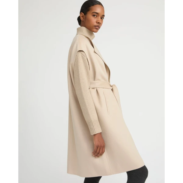 Woman wearing Yves Salomon shearling fur coat – luxury outerwear at Coveti