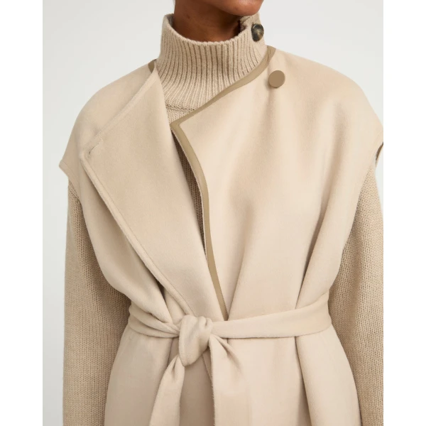 Woman wearing Yves Salomon shearling fur coat – luxury outerwear at Coveti