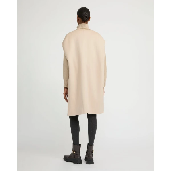 Woman wearing Yves Salomon shearling fur coat – luxury outerwear at Coveti