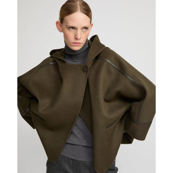 Woman wearing Yves Salomon shearling fur coat – luxury outerwear at Coveti