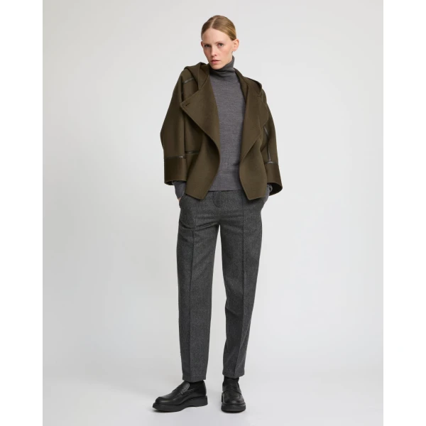 Woman wearing Yves Salomon shearling fur coat – luxury outerwear at Coveti
