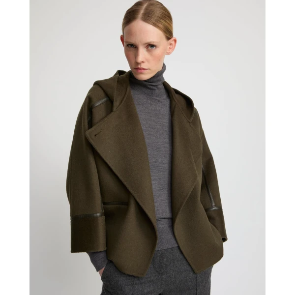Woman wearing Yves Salomon shearling fur coat – luxury outerwear at Coveti