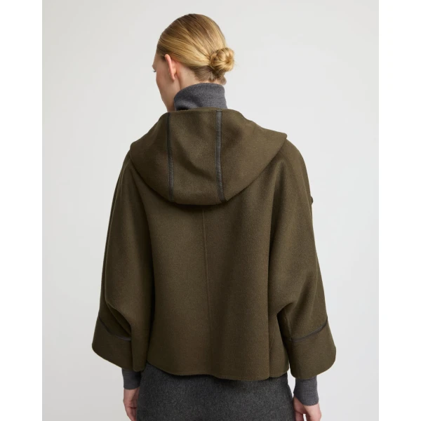 Woman wearing Yves Salomon shearling fur coat – luxury outerwear at Coveti