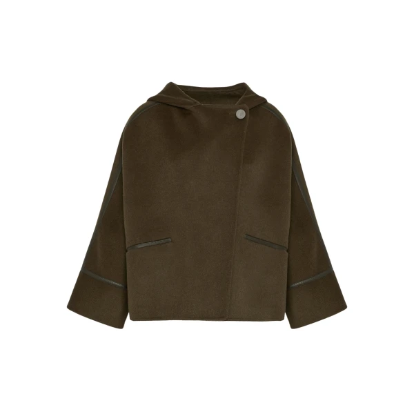 Woman wearing Yves Salomon shearling fur coat – luxury outerwear at Coveti