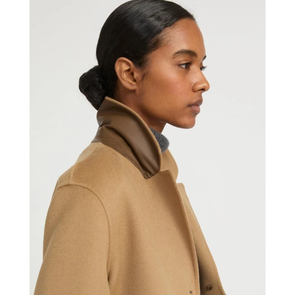 Woman wearing Yves Salomon shearling fur coat – luxury outerwear at Coveti