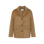 Woman wearing Yves Salomon shearling fur coat – luxury outerwear at Coveti