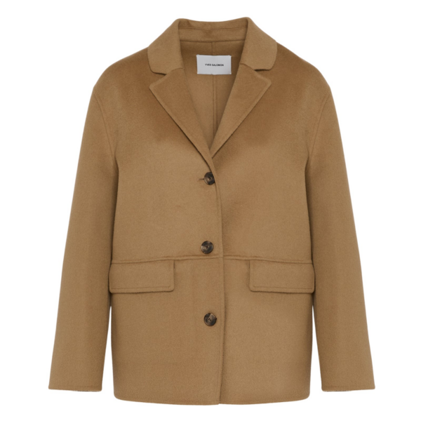 Woman wearing Yves Salomon shearling fur coat – luxury outerwear at Coveti