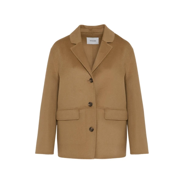 Woman wearing Yves Salomon shearling fur coat – luxury outerwear at Coveti