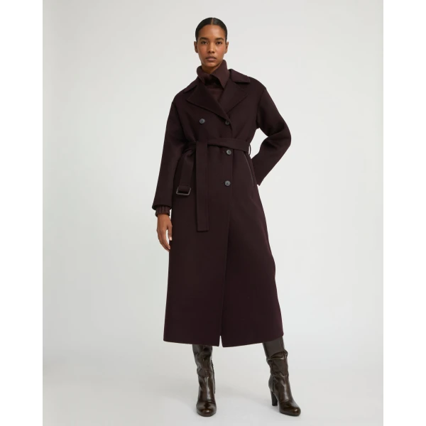 Woman wearing Yves Salomon shearling fur coat – luxury outerwear at Coveti