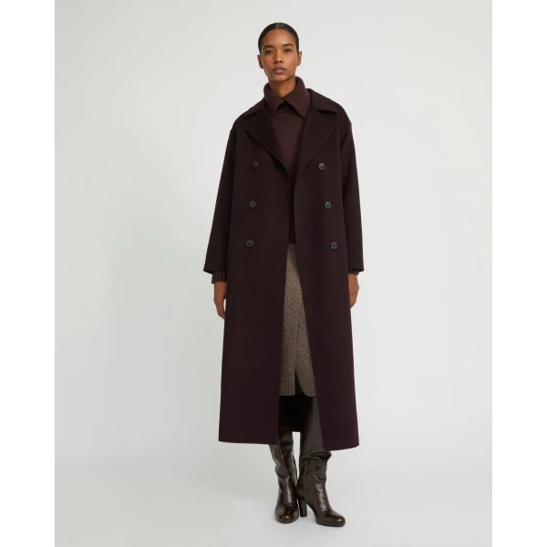 Woman wearing Yves Salomon shearling fur coat – luxury outerwear at Coveti