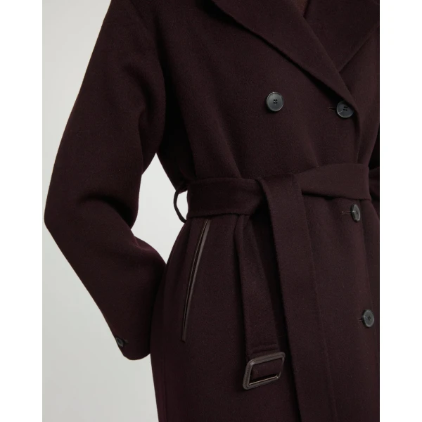 Woman wearing Yves Salomon shearling fur coat – luxury outerwear at Coveti