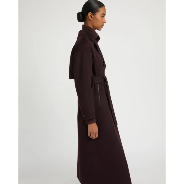 Woman wearing Yves Salomon shearling fur coat – luxury outerwear at Coveti