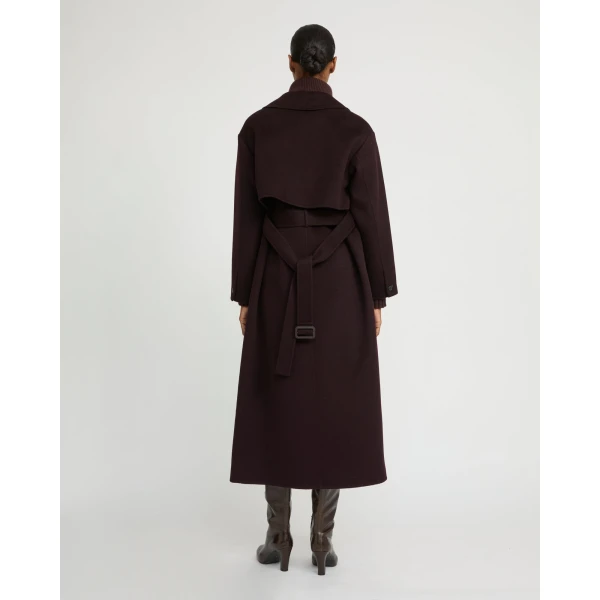 Woman wearing Yves Salomon shearling fur coat – luxury outerwear at Coveti