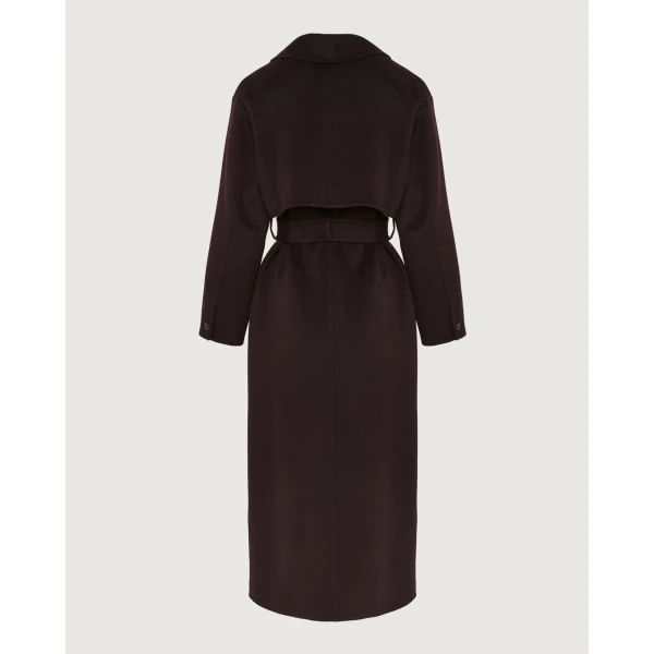 Woman wearing Yves Salomon shearling fur coat – luxury outerwear at Coveti