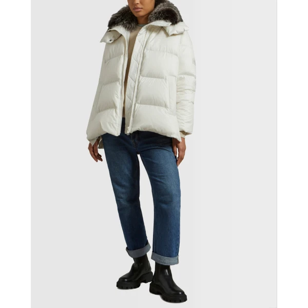 Woman wearing Yves Salomon shearling fur coat – luxury outerwear at Coveti