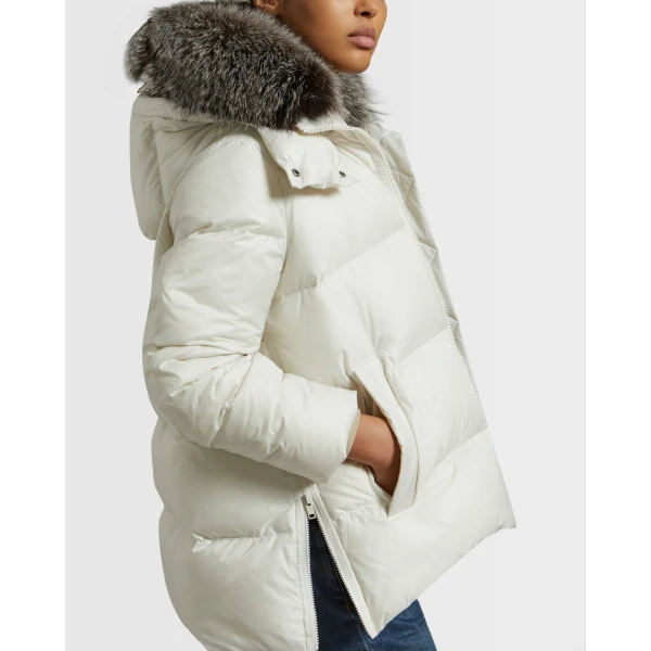 Woman wearing Yves Salomon shearling fur coat – luxury outerwear at Coveti