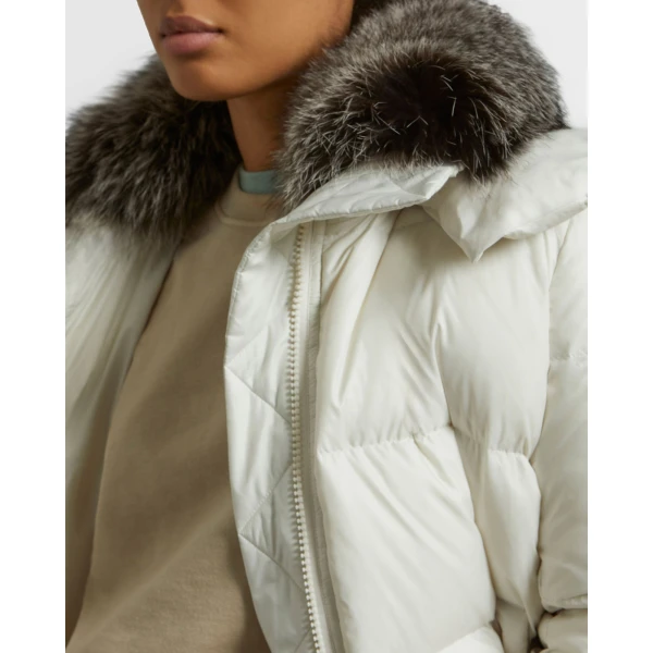 Woman wearing Yves Salomon shearling fur coat – luxury outerwear at Coveti