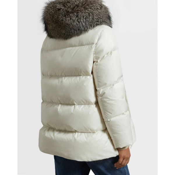 Woman wearing Yves Salomon shearling fur coat – luxury outerwear at Coveti