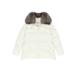 Woman wearing Yves Salomon shearling fur coat – luxury outerwear at Coveti