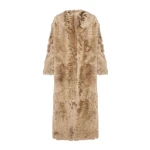 Woman wearing Yves Salomon shearling fur coat – luxury outerwear at Coveti