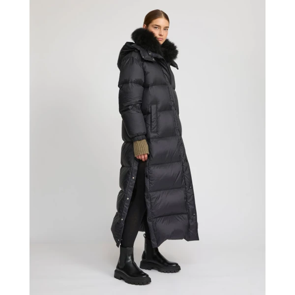 Woman wearing Yves Salomon shearling fur coat – luxury outerwear at Coveti