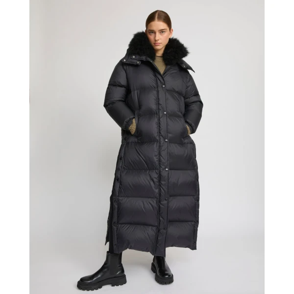 Woman wearing Yves Salomon shearling fur coat – luxury outerwear at Coveti