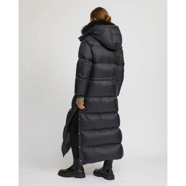 Woman wearing Yves Salomon shearling fur coat – luxury outerwear at Coveti